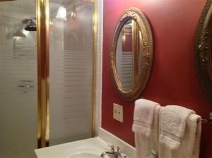 a bathroom with a sink and a mirror at Strawberry Farm B and B in Muscatine