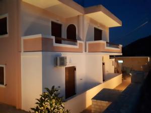 a view of a building at night at Mihal Suites in Sarandë
