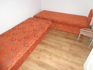 Voodi või voodid majutusasutuse Éva Apartman toas