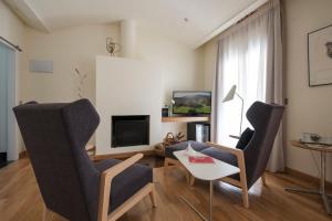 TV a/nebo společenská místnost v ubytování La Alcoba del Agua Hotel Boutique