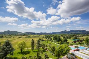 an aerial view of a park with a pool and trees at Hotel Terme Leonardo in Abano Terme