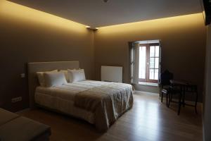 Postel nebo postele na pokoji v ubytování Feira Hostel & Suites