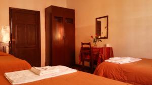 Postel nebo postele na pokoji v ubytování Hotel Huasi Continental