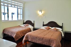 Postel nebo postele na pokoji v ubytování Hotel Europa