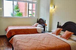 Postel nebo postele na pokoji v ubytování Hotel Europa