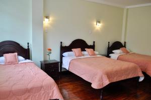 Postel nebo postele na pokoji v ubytování Hotel Europa
