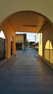 an empty street with an archway in a building at Bourbong St Motel in Bundaberg
