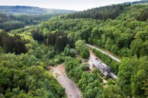 an aerial view of a train in the middle of a forest at Auberge Au Naturel des Ardennes in Rochehaut +38 photos