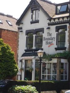 a building with a sign for the boundary hotel at The Boundary Hotel - B&B in Leeds