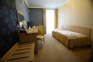 Posteľ alebo postele v izbe v ubytovaní Hotel Fajkier