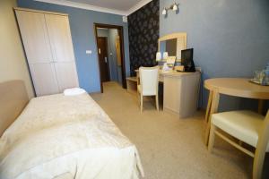 Posteľ alebo postele v izbe v ubytovaní Hotel Fajkier