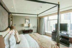 TV a/nebo společenská místnost v ubytování Tangla Hotel Tianjin