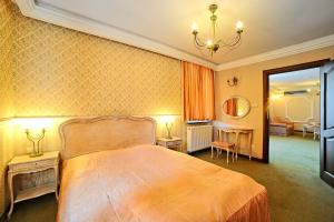Posteľ alebo postele v izbe v ubytovaní Hotel Fajkier