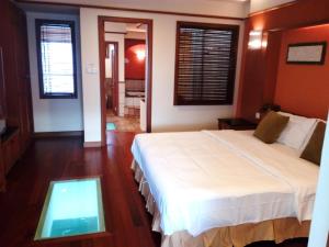 מיטה או מיטות בחדר ב-Wonderland Private Chalet at Port Dickson