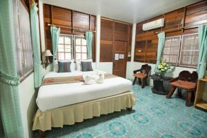 Pongphen Guesthouse - SHA Plus Certified客房内的一张或多张床位