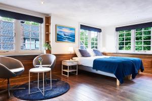 Postel nebo postele na pokoji v ubytování Guesthouse Villa Emmen