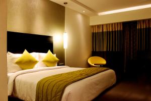 Postel nebo postele na pokoji v ubytování HYCINTH Hotels