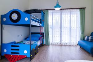 Postel nebo postele na pokoji v ubytování Wendy's home Toucheng Mansion B