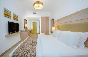 Posteľ alebo postele v izbe v ubytovaní Toledo Amman Hotel
