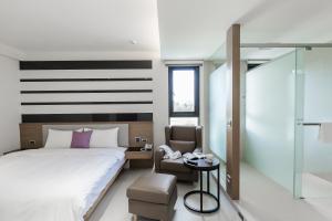 Postel nebo postele na pokoji v ubytování Ai Mei Homestay