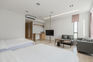 Postel nebo postele na pokoji v ubytování Ai Mei Homestay