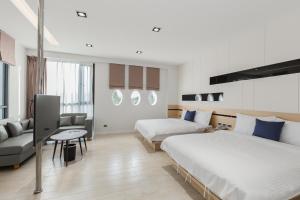 Postel nebo postele na pokoji v ubytování Ai Mei Homestay