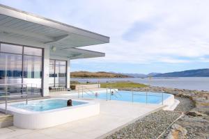 a house with a hot tub and a swimming pool at Portavadie Loch Fyne Scotland in Portavadie