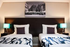 Tempat tidur dalam kamar di Nations Porto - Studios & Suites