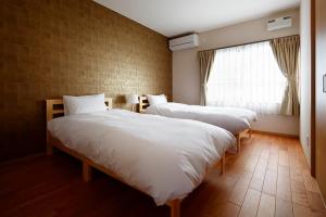 Кровать или кровати в номере 宿屋 天空