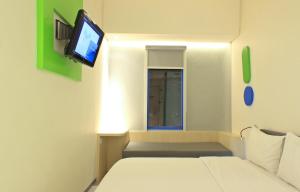 Postel nebo postele na pokoji v ubytování POP! Hotel Festival Citylink