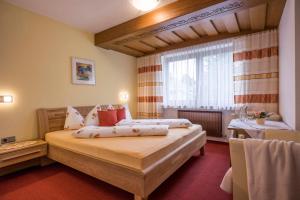 Postel nebo postele na pokoji v ubytování Gästehaus Gisela