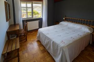 Postel nebo postele na pokoji v ubytování As Areas II + 8 fotografií