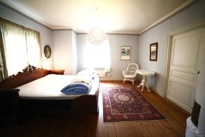 Postel nebo postele na pokoji v ubytování Prästgatanett Apartments