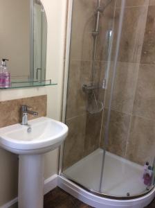 a bathroom with a shower and a sink at Zeal Farm in Dulverton +16 photos