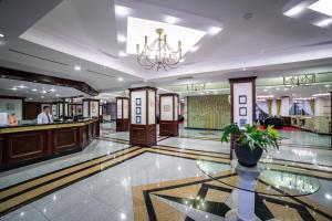 a lobby of a hotel with a bar at Helena Park - Ultra All Inclusive in Sunny Beach