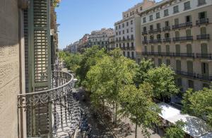 a view of a city street with trees and buildings at Mosaic by Ona in Barcelona
