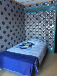 Ένα ή περισσότερα κρεβάτια σε δωμάτιο στο Le Dépôt