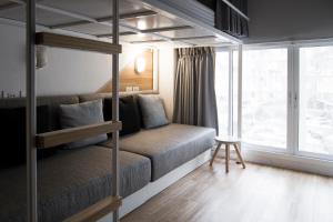 Ένα ή περισσότερα κρεβάτια σε δωμάτιο στο Bed One Block Hostel