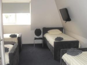 Ένα ή περισσότερα κρεβάτια σε δωμάτιο στο Hotel de Harmonie