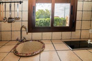 a bathroom with a sink and a window at La Vega del Prado in Tarifa