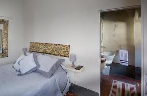 Postel nebo postele na pokoji v ubytování Roveta Apartment