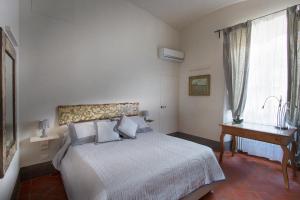 Postel nebo postele na pokoji v ubytování Roveta Apartment