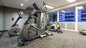 a gym with cardio equipment in a room with a window at Best Western Grant Park Hotel in Chicago