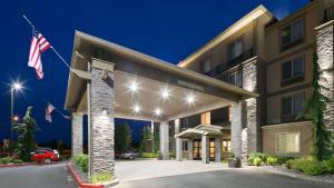 a rendering of the front of a hotel with an american flag at Best Western Plus Port of Camas-Washougal Convention Center in Washougal