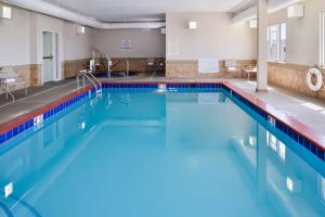 a large swimming pool with blue water at Best Western Plus Frontier Inn in Cheyenne