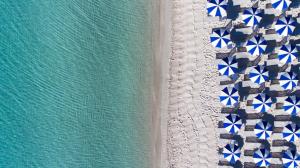 an overhead view of the beach and the ocean at Hotel Dei Pini in Alghero