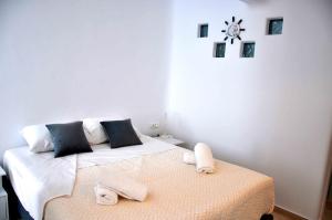 Postel nebo postele na pokoji v ubytování Amarain Mykonos