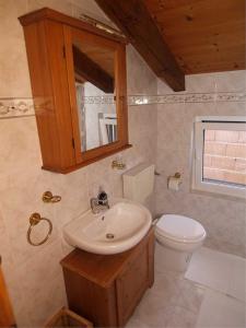 a bathroom with a sink and a toilet at Apartment Skiper in Veli Lošinj