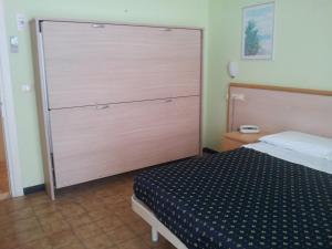 Postel nebo postele na pokoji v ubytování Hotel Delle Mimose