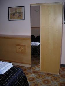 Postel nebo postele na pokoji v ubytování Hotel Delle Mimose